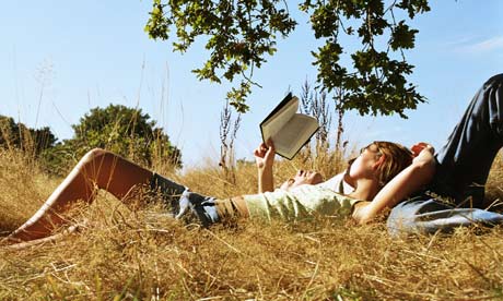 Young-couple-reading-a-bo-001